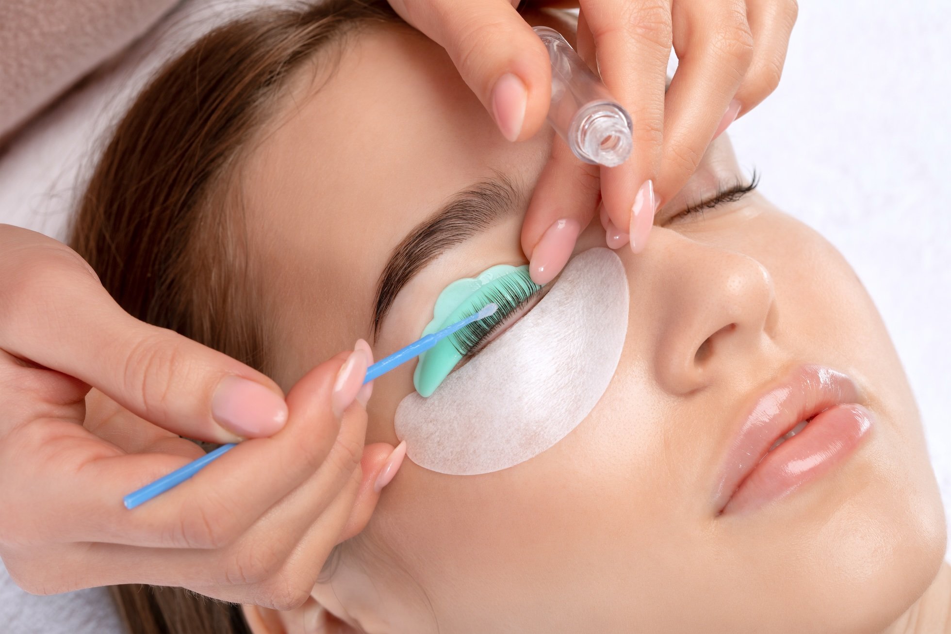 Woman receiving an eyelash treatment